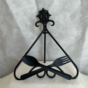 Black iron cookbook holder.
